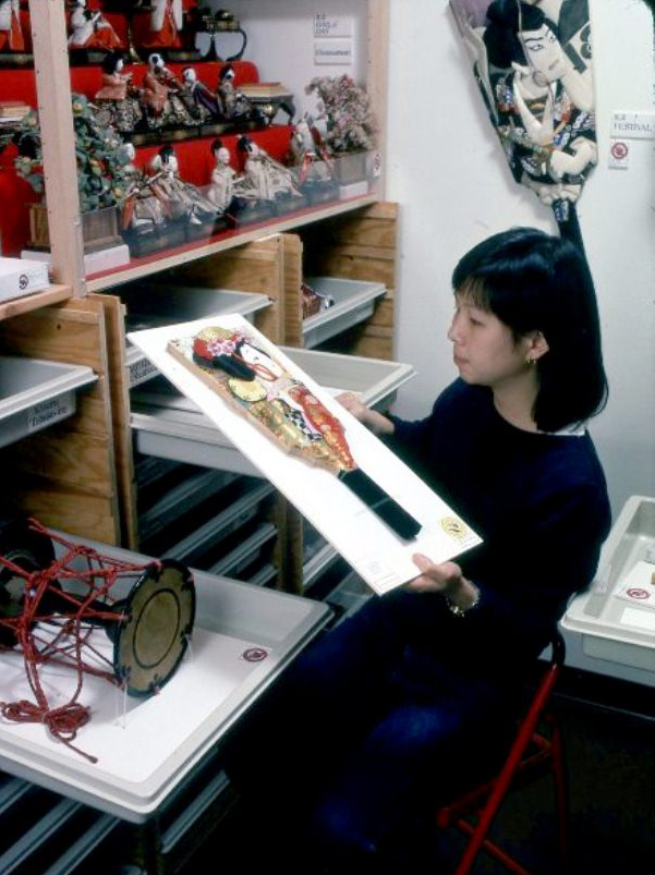 1983 Woman holding artwork